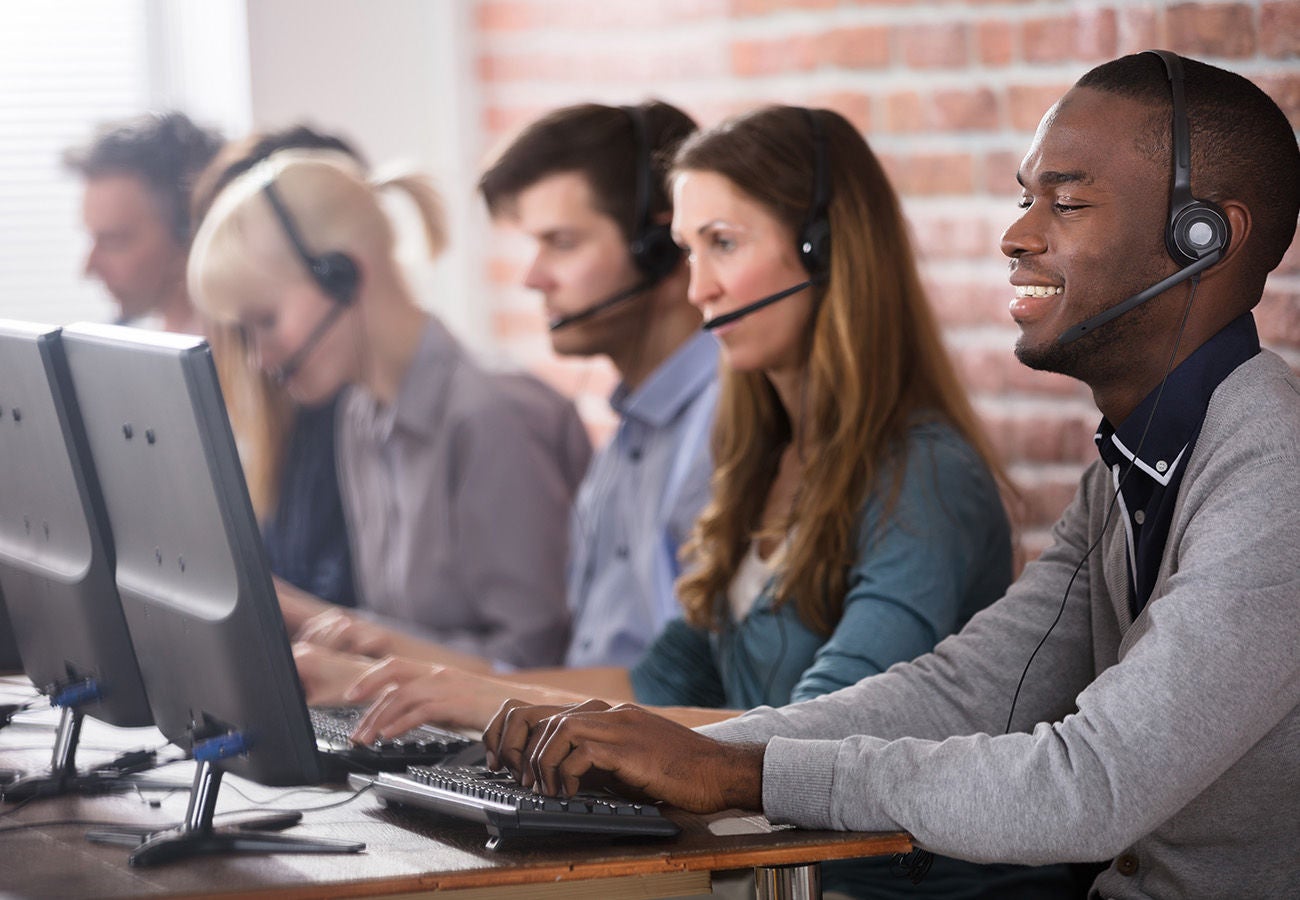 Group of happy call center representatives 