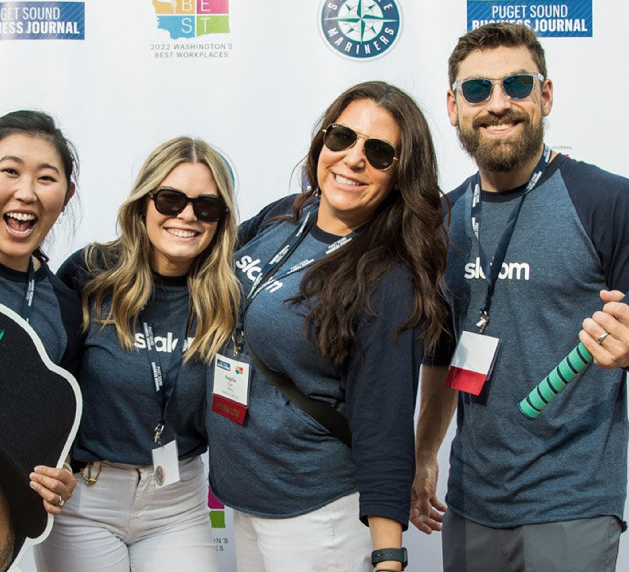 Slalom employee Angela stands with a group of employees.