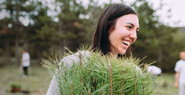 woman in feld with tree