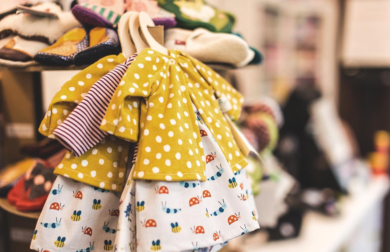 Baby dress with polka dots and ladybugs on display at a Carter's store.