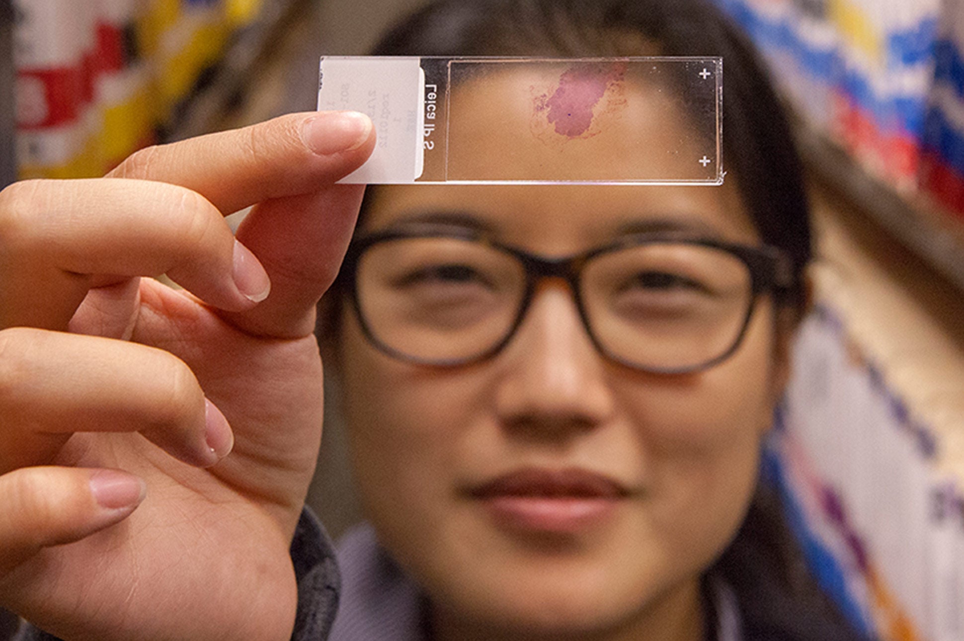 A woman scientist looking at lab results.