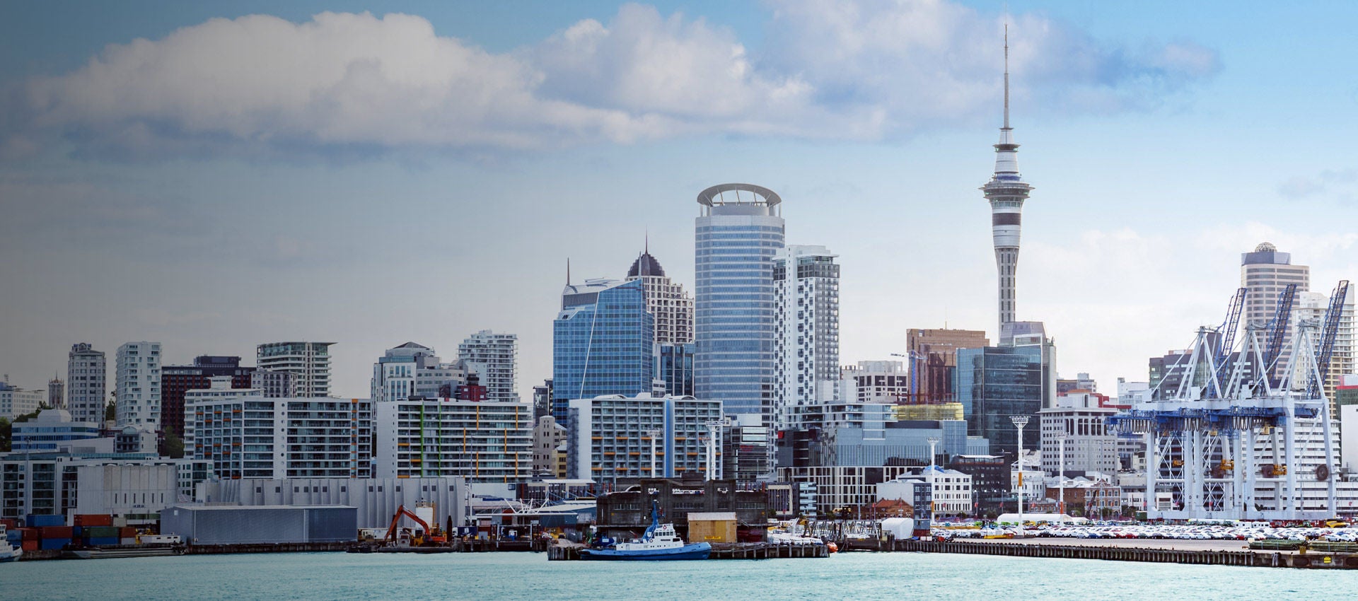 The Auckland skyline as seen on a pleasant day from the harbor. 