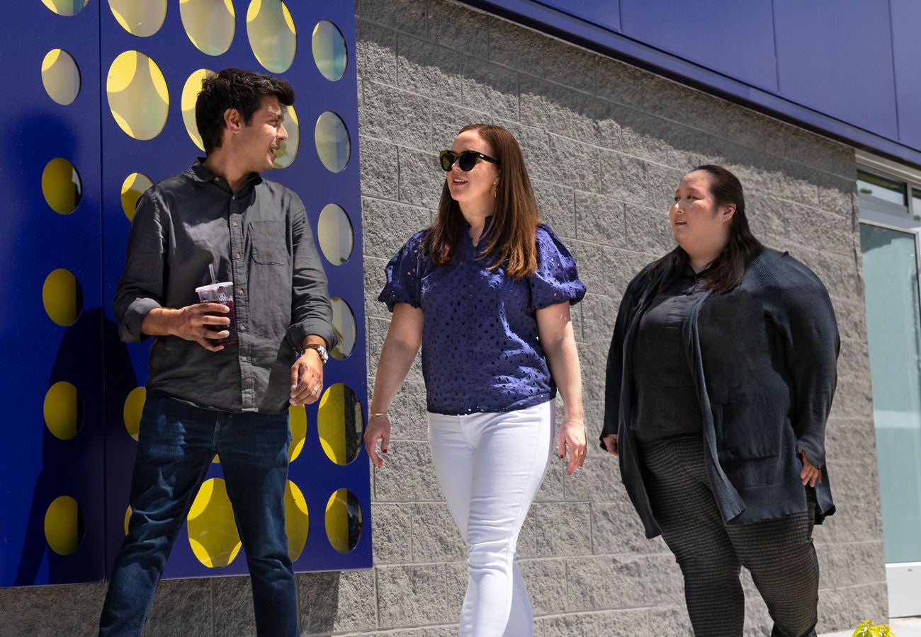 The Slalom team talks with the CosMc's team at the Bolingbrook location on a sunny afternoon.